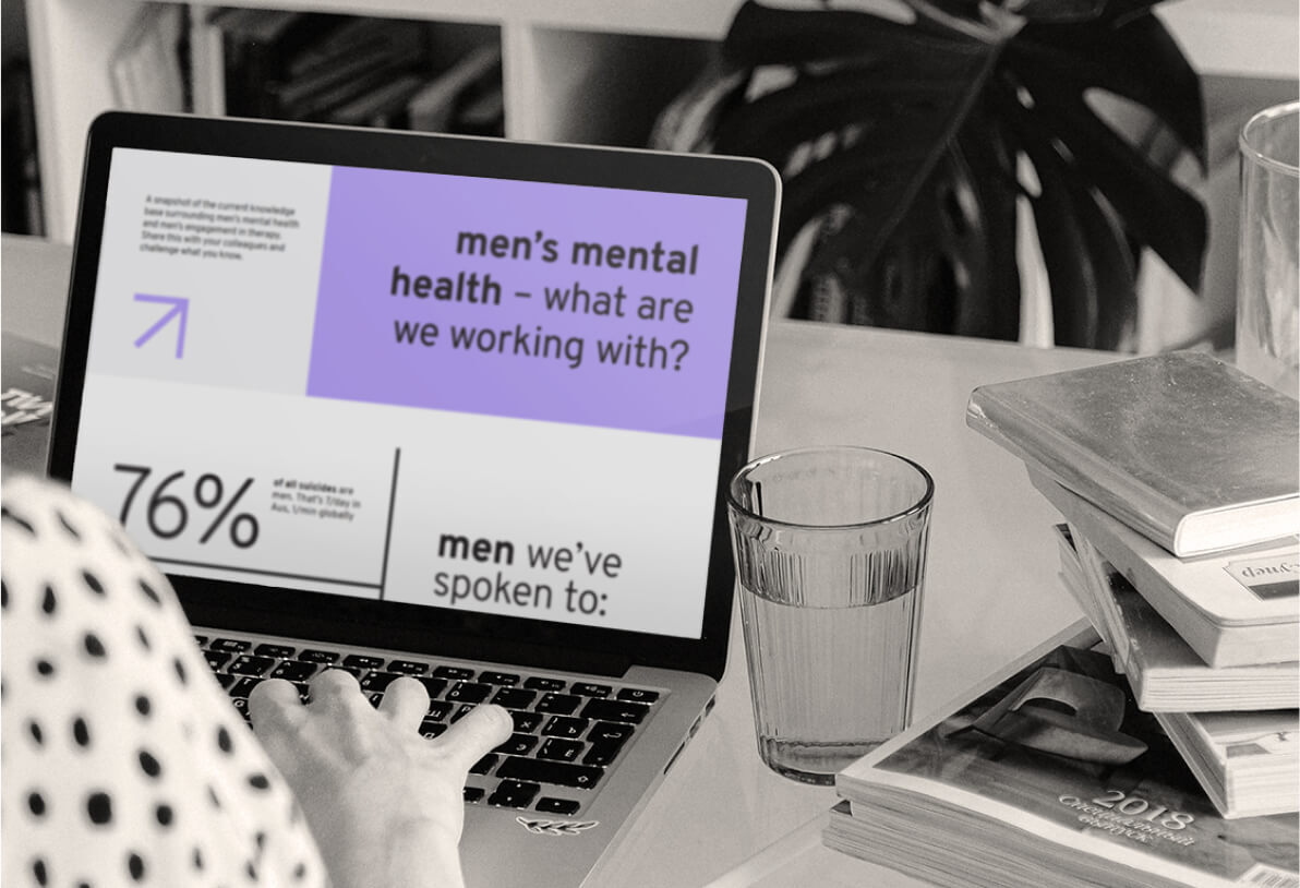 Person learning about men's mental health on a laptop